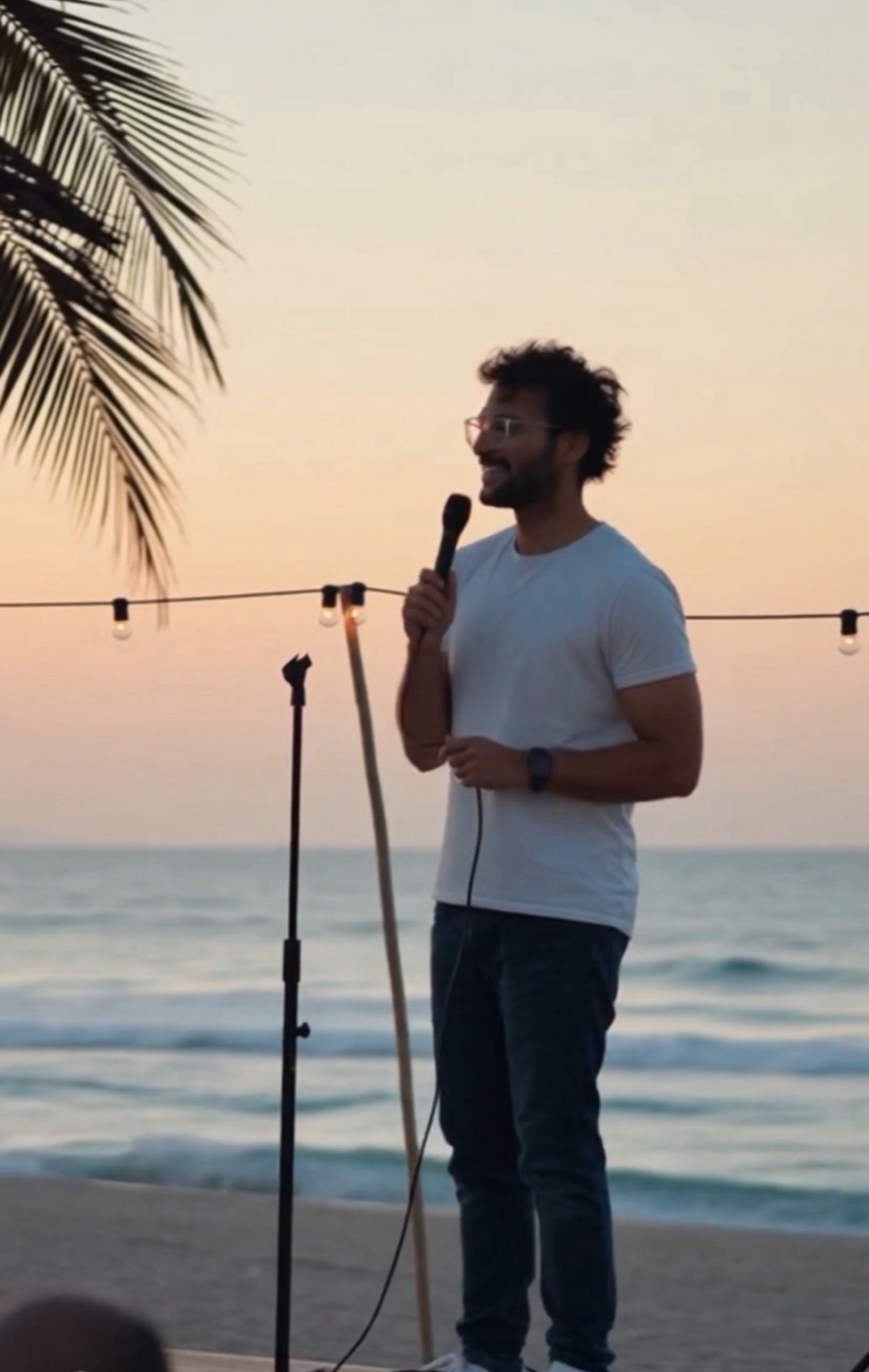 Sean performing with palm fronds visible